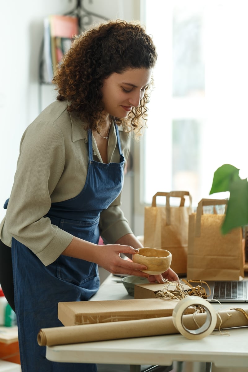 Online store owner packing customer orders, ecommerce SEO services